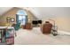 Large loft space featuring seating area, televisions, and dormer window at 1209 Persimmon Way, Mcdonough, GA 30252