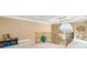 Spacious loft area featuring a decorative chandelier, railing, and neutral-toned walls at 1209 Persimmon Way, Mcdonough, GA 30252