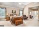 Bright primary bedroom featuring a ceiling fan and private adjoining bathroom entrance at 1209 Persimmon Way, Mcdonough, GA 30252