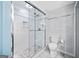Newly renovated bathroom featuring a glass-enclosed shower, toilet, and modern fixtures at 1379 Keys Lake Ne Dr, Brookhaven, GA 30319