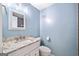 Stylish bathroom with granite countertop, modern fixtures, and updated mirror at 1379 Keys Lake Ne Dr, Brookhaven, GA 30319