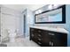 Charming bathroom with tile floor, modern vanity, dual sinks, and updated fixtures at 1379 Keys Lake Ne Dr, Brookhaven, GA 30319