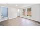 Bedroom with natural light, hardwood floors, and a view of the outdoors at 1379 Keys Lake Ne Dr, Brookhaven, GA 30319