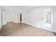 The bright, open living area features hardwood floors, white walls, and a door to the exterior at 1379 Keys Lake Ne Dr, Brookhaven, GA 30319