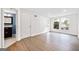 Bright living room features hardwood floors, white walls, and natural light streaming through large windows at 1379 Keys Lake Ne Dr, Brookhaven, GA 30319