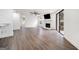 Open-concept living room with wood floors, recessed lighting, and a view of the kitchen at 1379 Keys Lake Ne Dr, Brookhaven, GA 30319
