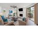 Staged living room with a fireplace, modern furniture, and bright windows at 1379 Keys Lake Ne Dr, Brookhaven, GA 30319
