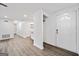 Bright living room with wood floors and a view of the kitchen area at 1379 Keys Lake Ne Dr, Brookhaven, GA 30319