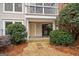 Back porch in a wooded area, with a sliding glass door and lush landscaping for privacy at 1379 Keys Lake Ne Dr, Brookhaven, GA 30319
