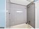 Contemporary shower features sleek gray tile and modern fixtures for a spa-like experience at 1379 Keys Lake Ne Dr, Brookhaven, GA 30319