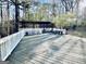 Spacious back deck with wooden floorboards and backyard views at 114 Rolling Grn, Peachtree City, GA 30269