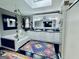 Bright bathroom boasts a skylight, soaking tub, and double vanity with granite countertops and decorative carpet at 114 Rolling Grn, Peachtree City, GA 30269