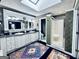 Bright bathroom boasts a skylight, double vanity with granite countertops, and tiled walk-in shower at 114 Rolling Grn, Peachtree City, GA 30269