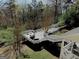 Aerial view of a multi-level wooden deck, perfect for outdoor dining and entertaining in a peaceful setting at 114 Rolling Grn, Peachtree City, GA 30269