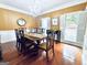 Elegant dining room featuring decorative lighting, moldings, and hardwood floors at 114 Rolling Grn, Peachtree City, GA 30269