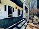 Charming porch with wood floors, and white columns on a beautiful traditional home at 114 Rolling Grn, Peachtree City, GA 30269