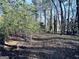 Scenic wooded acreage providing privacy and a natural setting at 114 Rolling Grn, Peachtree City, GA 30269