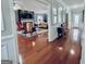 Spacious living room with hardwood floors, fireplace, modern ceiling fans, and natural light at 114 Rolling Grn, Peachtree City, GA 30269