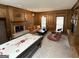 Cozy living room with wood paneling, fireplace, and built-in shelving at 114 Rolling Grn, Peachtree City, GA 30269