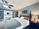 Lovely main bedroom with ceiling fan and en-suite bathroom featuring double doors at 114 Rolling Grn, Peachtree City, GA 30269