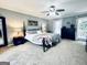 Comfortable main bedroom with ceiling fan and view to bathroom at 114 Rolling Grn, Peachtree City, GA 30269