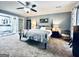 Spacious main bedroom with plush carpet and a view into the main bathroom at 114 Rolling Grn, Peachtree City, GA 30269
