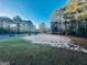Community recreational area offering tennis and sand volleyball courts, surrounded by mature trees at 114 Rolling Grn, Peachtree City, GA 30269