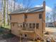 This backyard features a wood deck with access to yard and basement at 505 Summer Ter, Woodstock, GA 30189
