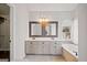 Bright bathroom featuring a double sink vanity with granite counters and a separate soaking tub at 505 Summer Ter, Woodstock, GA 30189