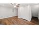 Bedroom features hardwood floors, closet doors, a ceiling fan, neutral paint and white trim at 505 Summer Ter, Woodstock, GA 30189