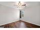 Neutral bedroom with hardwood floors, ceiling fan and a large window with natural light at 505 Summer Ter, Woodstock, GA 30189