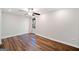 Bedroom with hardwood floors, base trim, neutral walls and ceiling fan at 505 Summer Ter, Woodstock, GA 30189