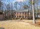 Charming two-story brick home featuring blue shutters and a spacious front yard at 505 Summer Ter, Woodstock, GA 30189