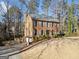 Charming two-story brick home featuring blue shutters and a side deck at 505 Summer Ter, Woodstock, GA 30189