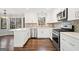 Bright, updated kitchen featuring stainless steel appliances, granite counters, and white cabinetry at 505 Summer Ter, Woodstock, GA 30189