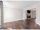Bright living room featuring hardwood floors, a fireplace, and neutral walls at 505 Summer Ter, Woodstock, GA 30189