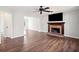 Spacious living room with a ceiling fan, brick fireplace, and abundant natural light at 505 Summer Ter, Woodstock, GA 30189
