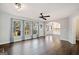 Inviting living room with hardwood floors, large windows and an archway view to the kitchen at 505 Summer Ter, Woodstock, GA 30189
