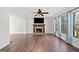Bright living room featuring wood flooring, a brick fireplace, and large windows with natural light at 505 Summer Ter, Woodstock, GA 30189
