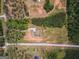 Aerial view of a homesite featuring a residence, landscaped grounds, and tree line at 296 Beavers Rd, Grantville, GA 30220