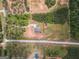 An aerial shot showcasing a home, driveway, and surrounding lot and landscape at 296 Beavers Rd, Grantville, GA 30220