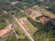 Drone shot of homes nestled in wooded area with long driveways at 296 Beavers Rd, Grantville, GA 30220