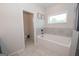 Bathroom features a separate toilet room and a soaking tub at 296 Beavers Rd, Grantville, GA 30220