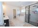 Bright bathroom with a glass-enclosed shower and a soaking tub at 296 Beavers Rd, Grantville, GA 30220
