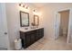 Well-lit bathroom with double vanity and a separate toilet room at 296 Beavers Rd, Grantville, GA 30220