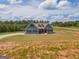 Attractive two-story home with a landscaped front yard and circular driveway at 296 Beavers Rd, Grantville, GA 30220