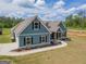 Beautiful two-story home with blue siding, black shutters, and a well-maintained lawn at 296 Beavers Rd, Grantville, GA 30220