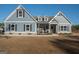 Charming single-Gathering home with blue siding, black shutters, and inviting front porch at 296 Beavers Rd, Grantville, GA 30220