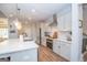 Well-lit kitchen with a center island, stainless steel appliances, and ample counter space at 296 Beavers Rd, Grantville, GA 30220