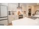 Bright kitchen with stainless steel appliances, island with sink, and modern countertops at 296 Beavers Rd, Grantville, GA 30220